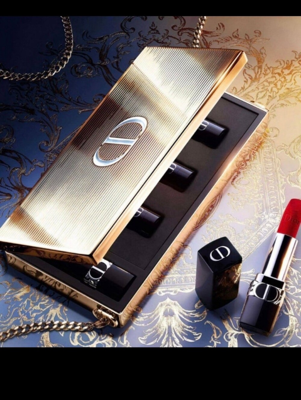 The "Dior Lipstick Clutch" (Minaudière) featuring shades 965, 913, 674, and 471